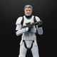 A six-inch action figure of George Lucas in Stormtrooper armor hefts his blaster rifle.